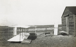 Side view of Wright 1911 glider sitting on sand