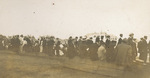 Spectators watching Orville Wright and the Wright Model A Flyer