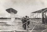 Wilbur Wright examining Wright 1907 Model Flyer