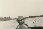 Man Steering a Boat