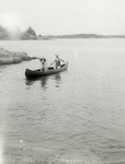 Orville Wright and Scipio in a Canoe