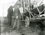 Wilbur Wright looking over a Wright Model A Flyer at the Harvard-Boston Aero Meet, September, 1910