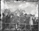 Spectators standing by a fence at the Harvard-Boston Aero Meet, September, 1910