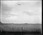 Lincoln Beachey flying over a racetrack in Saugus, Massachusetts during the Harvard-Boston Aero Meet, August - September, 1911