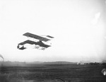 Claude Grahame-White and Anthony Philpott flying in a Farman biplane above the field at the Harvard-Boston Aero Meet, September, 1910 by Anthony Philpott
