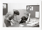 Staff taking blood pressure