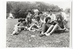 Students sitting in a field