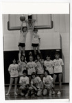 Girls' basketball team posing