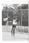 Student swinging tennis racket
