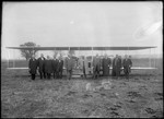 Men standing by Wright Model B