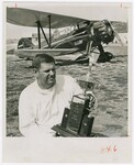 John W. Church displays his Grand Champion trophy he won for his rebuilt WACO-D, 1934 model. by Dayton Daily News and Joe Wissel