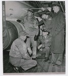 Men Viewing the GAM 77 Hound Dog Missile by Dayton Daily News and Ed Johnsey