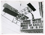The Wright-B-Flyer Lifted to the Top of the Marquee of the Victory Theatre by Dayton Daily News and Al Wilson