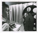Negative Assembler Working on the Film Reproduction Process. by Dayton Daily News and George E. Adams