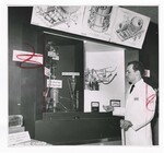 A WADC Scientist Stands in Front of a Model by Dayton Daily News and Al Wilson
