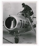 Pilot Climbs into a Mikoyan-Gurevich MiG-15 by Dayton Daily News and Bob Doty