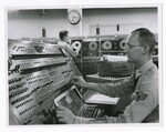 Serviceman Operating a UNIVAC by Dayton Daily News and George E. Adams