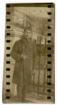 Portrait of a soldier standing near a gate