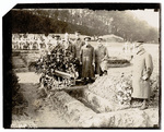 Officers standing around a grave