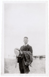 Man in suit at beach
