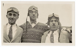 Three men in pilot's goggles posing