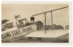 Two men with biplane